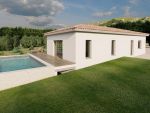 Construction d'une maison plain pied de 122 m² avec débord de toit et piscine