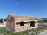 Pose de la charpente de la première maison, écran sous toiture et litelage