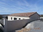 Réalisation d'une maison de plain-pied avec garage et terrasse en Ytong de 0.25 cms